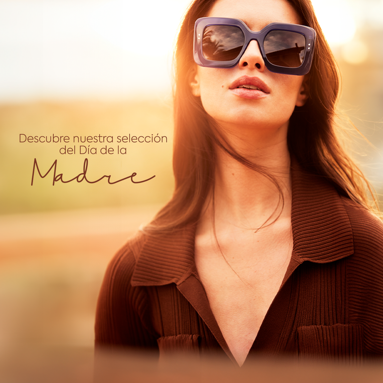 a woman with glasses looking at you seductively